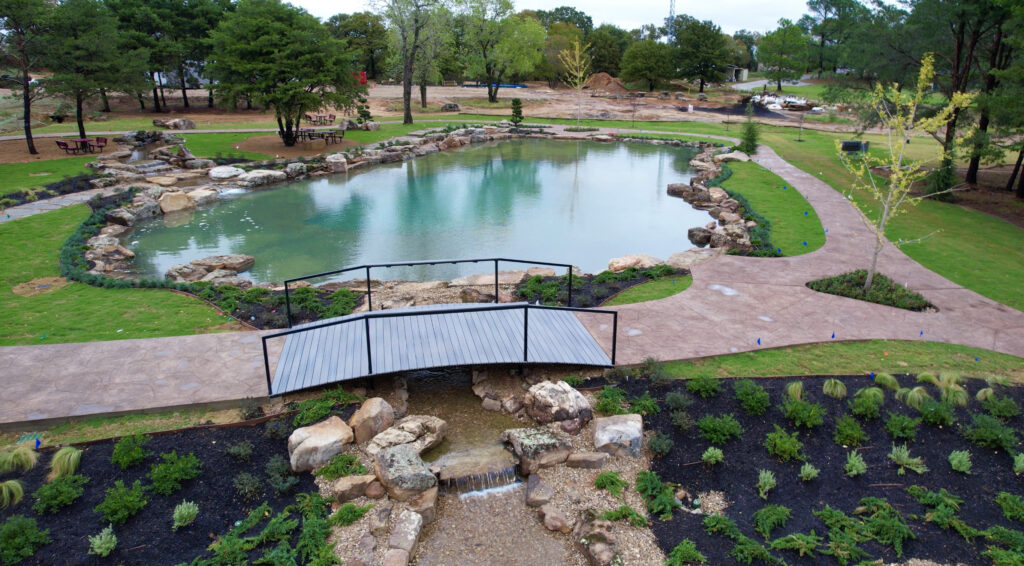 Scenic park with lake and footbridge view